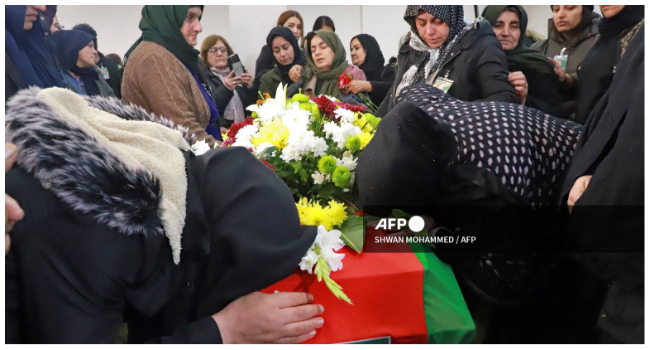 Iraqi Kurds attend the funeral of Emine Kara, a Kurdish woman who was killed during a shooting attack in Paris last month, on January 5, 2023, in the Kurdish city of Sulaimaniyah in northern Iraq. (Photo by Shwan MOHAMMED / AFP)