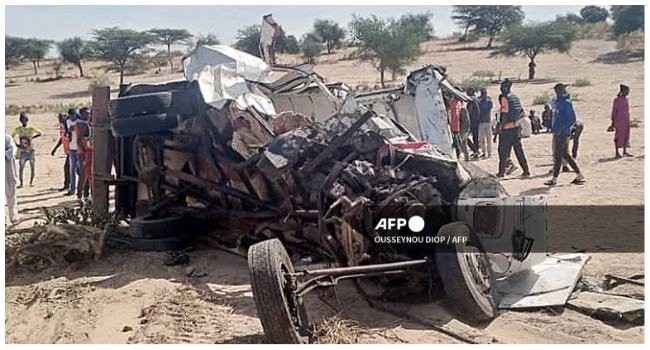 A general view of an accident scene near Sakal, northern Senegal, on January 16, 2023 where nineteen people were killed when a bus and a truck collided. (Photo by Ousseynou Diop / AFP)