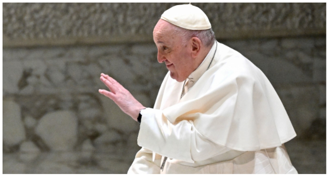 Pope Francis blesses attendees at the start of the weekly general audience on January 25, 2023 at Paul-VI hall in The Vatican. (Photo by Tiziana FABI / AFP)