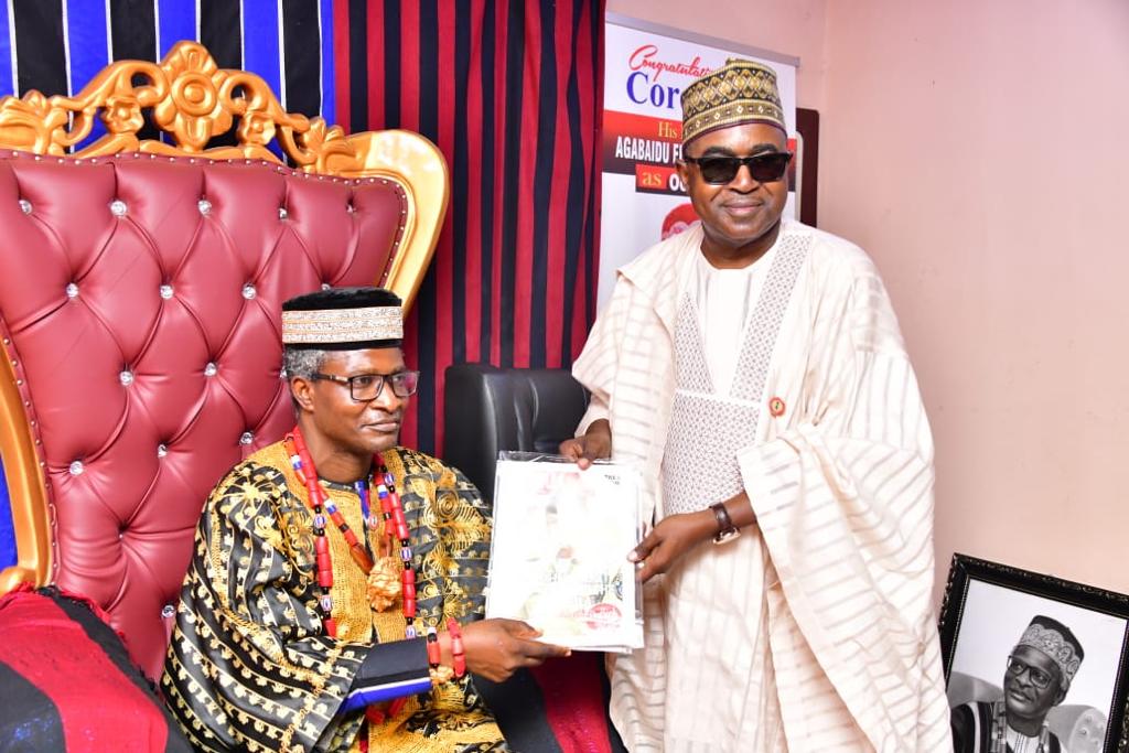 Chairman/Chief Executive Officer of NDLEA, Brig. Gen. Mohamed Buba Marwa (Retd.) CON, OFR, DSS; presenting some copies of the Agency's official publication, NDLEA Today, to Agabaidu Elaigwu, Odogbo Obagaji John, Ochi'Idoma (V) during a courtesy visit to the monarch in Otukpo, Benue State on Monday 23rd January 2023.