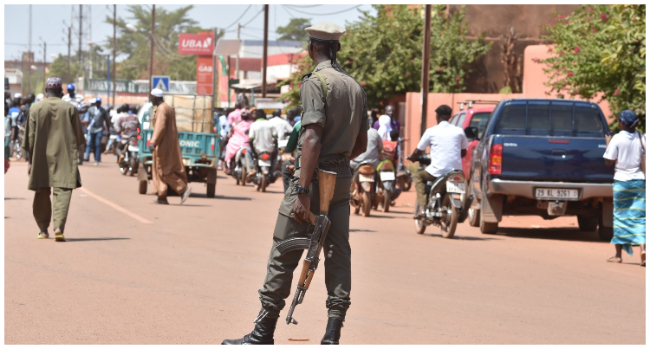 FILES) In this file photo taken on October 29, 2018 shows a policeman patrolling in the center of Ouahigouya, eastern Burkina Faso. (Photo by ISSOUF SANOGO / AFP) 