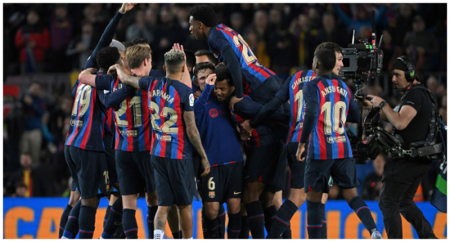 Barcelona's players celebrate at the end of the Spanish league football match between FC Barcelona and Real Madrid CF at the Camp Nou stadium in Barcelona on March 19, 2023. (Photo by LLUIS GENE / AFP)