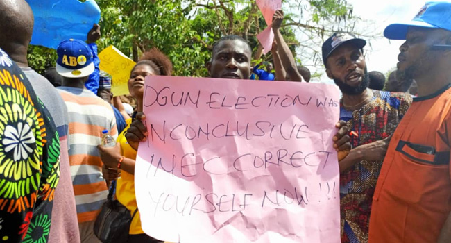 Gov. Election: PDP’s Adebutu Leads Protest In Ogun, APC Calls Him Sore Loser