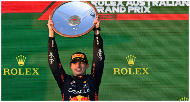 Red Bull Racing's Dutch driver Max Verstappen celebrates with the trophy on the podium after the 2023 Formula One Australian Grand Prix at the Albert Park Circuit in Melbourne on April 2, 2023. (Photo by Paul CROCK / AFP)