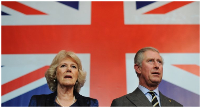 In this file photo taken on January 26, 2011 Britain’s Prince Charles (R) and Camilla, The Duchess of Cornwall (L) attend the Australia Day celebrations at Australia House, in London.  (Photo by Ben STANSALL / POOL / AFP)