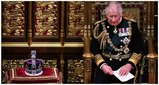 In this file photo taken on May 10, 2022 Britain's Prince Charles, Prince of Wales reacts after reading the Queen's Speech as he holds it in his hands in the House of Lords Chamber during the State Opening of Parliament at the Houses of Parliament, in London. (Photo by Ben Stansall / POOL / AFP) / NO USE AFTER MAY 18, 2023 15:45:01 GMT