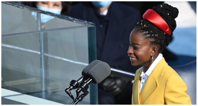 National youth poet laureate Amanda Gorman speaks during the inauguration of Joe Biden, at the US Capitol in Washington, DC, on January 20, 2021. (Photo by Brendan SMIALOWSKI / AFP)