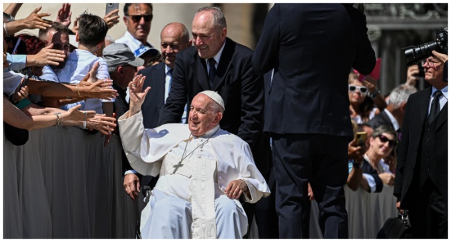 Pope Francis waves to attendees as he leaves at the end of the weekly general audience on June 7, 2023 at St. Peter's square as in The Vatican. (Photo by Andreas SOLARO / AFP)