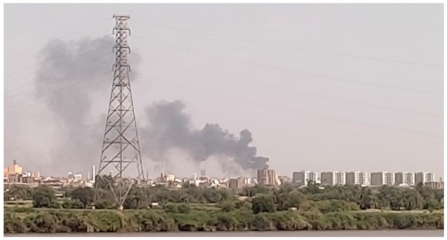 A picture taken from Omdurman shows smoke billowing north of Khartoum on July 22, 2023. (Photo by AFP)