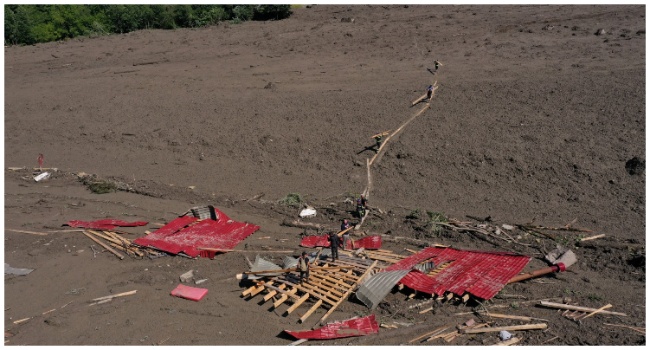 This aerial photo taken with a drone shows rescue personnel working at the site of a landslide in the western Georgian region of Racha on August 4, 2023. (Photo by STRINGER / AFP)