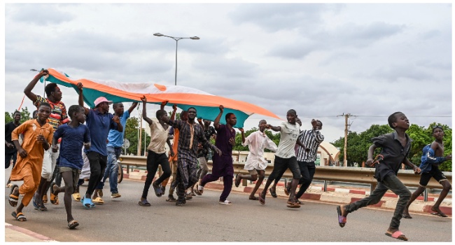 Supporters of Niger's National Council for the Safeguard of the Homeland (CNSP) gather for a demonstration in Niamey on August 11, 2023 near a French airbase in Niger. (Photo by AFP)