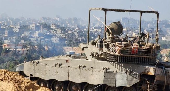 This handout picture released by the Israeli army on November 15, 2023, shows soldiers on an armed vehicle during a military operation around at Al-Shifa hospital in Gaza City, amid continuing battles between Israel and the Palestinian militant group Hamas.