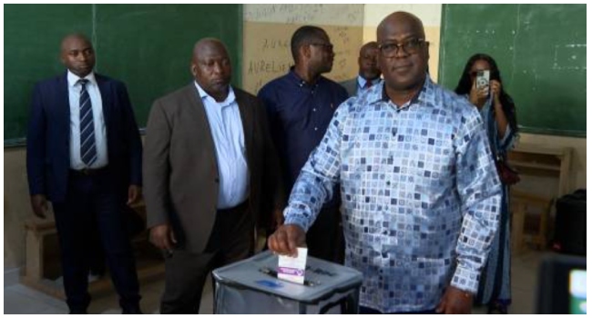 This video grab made from an AFPTV video taken on December 20, 2023 shows incumbent President of the Democratic Republic of Congo Felix Tshisekedi casting his ballot at the St Georges Kitambo polling station in Kinshasa.