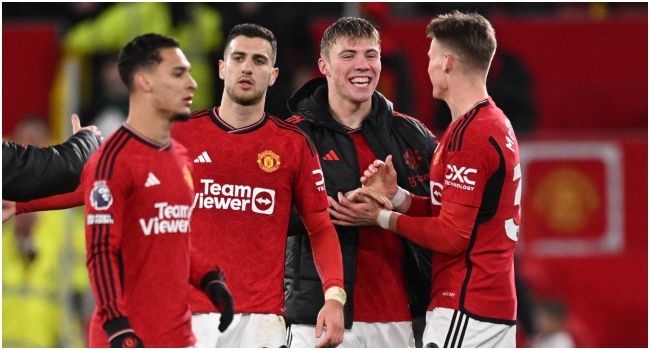 Manchester United's Danish striker #11 Rasmus Hojlund (2R) celebrates with teammates after the English Premier League football match between Manchester United and Aston Villa at Old Trafford in Manchester, north west England, on December 26, 2023. United won the game 3-2.