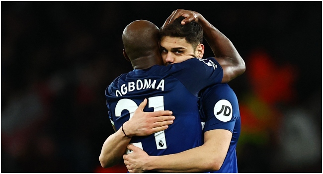 West Ham United's Italian defender #21 Angelo Ogbonna (L) celebrates with West Ham United's Greek defender #15 Konstantinos Mavropanos at the end of the English Premier League football match between Arsenal and West Ham at the Emirates Stadium in London on December 28, 2023.