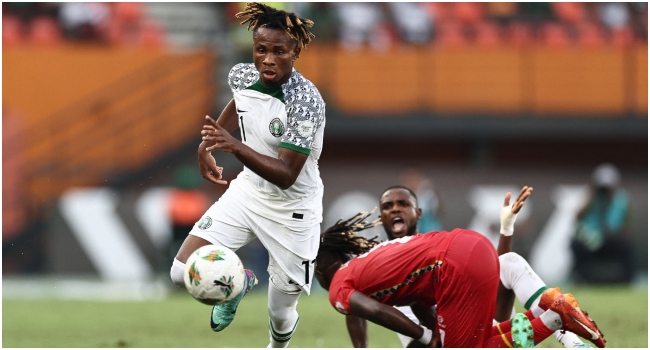 Nigeria's forward #11 Samuel Chukwueze (L) runs with the ball during the Africa Cup of Nations (CAN) 2024 group A football match between Guinea-Bissau and Nigeria at the Felix Houphouet-Boigny Stadium in Abidjan on January 22, 2024.