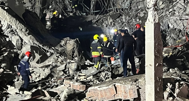 This handout photograph released and taken realy on January 16, 2024 by Kurdistan 24 broadcast news station shows firemen and security staff inspecting the rubble of a building at a site hit by a missile attack launched by Iran's Islamic Revolutionary Guard Corps (IRGC), in Arbil, the capital of Iraq's northern autonomous Kurdish region.