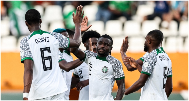 Nigeria's forward #15 Moses Simon (C) celebrates with teammates after scoring his team's first goal during the Africa Cup of Nations (CAN) 2024 group A football match between Guinea-Bissau and Nigeria at the Felix Houphouet-Boigny Stadium in Abidjan on January 22, 2024.