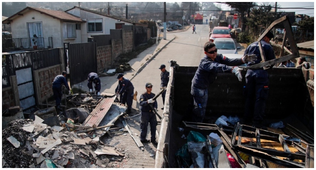 The death toll from central Chile's blazing wildfires climbed to at least 112 people on Sunday, after President Gabriel Boric warned the number would rise "significantly" as teams search gutted neighborhoods.