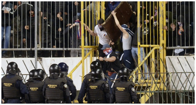 Members of Hajduk Split's ultra fan base, known as the Torcida, clash with police at the Poljud stadium in Split on April 3, 2024. (Photo by STRINGER / AFP) /CROATIA)