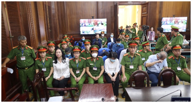 Vietnamese property tycoon Truong My Lan (front row 3nd L) looks on at a court in Ho Chi Minh city on April 11, 2024. A top Vietnamese property tycoon could face the death penalty when she and dozens of other co-accused face verdicts on April 11 in one of the country's biggest fraud cases over the embezzlement of USD 12.5 billion. (Photo by AFP)