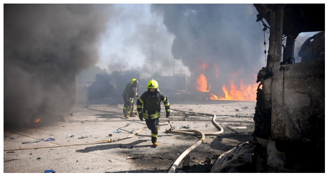 This handout photograph taken and released by the Ukrainian Emergency Service on August 26, 2024 shows rescuers working to extinguish a fire following a missile attack at an undisclosed location in Odesa region of Ukraine. Russian drones and missiles on August 26, 2024 targeted 15 regions across Ukraine in an overnight barrage aimed mainly at energy infrastructure, Ukrainian Prime Minister Denys Shmygal said. (Photo by Handout / UKRAINIAN EMERGENCY SERVICE / AFP) / RESTRICTED TO EDITORIAL USE - MANDATORY CREDIT "AFP PHOTO / HO / UKRAINIAN EMERGENCY SERVICE" - NO MARKETING NO ADVERTISING CAMPAIGNS - DISTRIBUTED AS A SERVICE TO CLIENTS