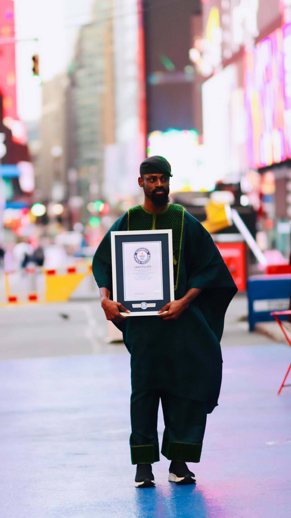 Onakoya with his GWR certificate confirming his new record of 64hours  Credit: X/Tunde_OD