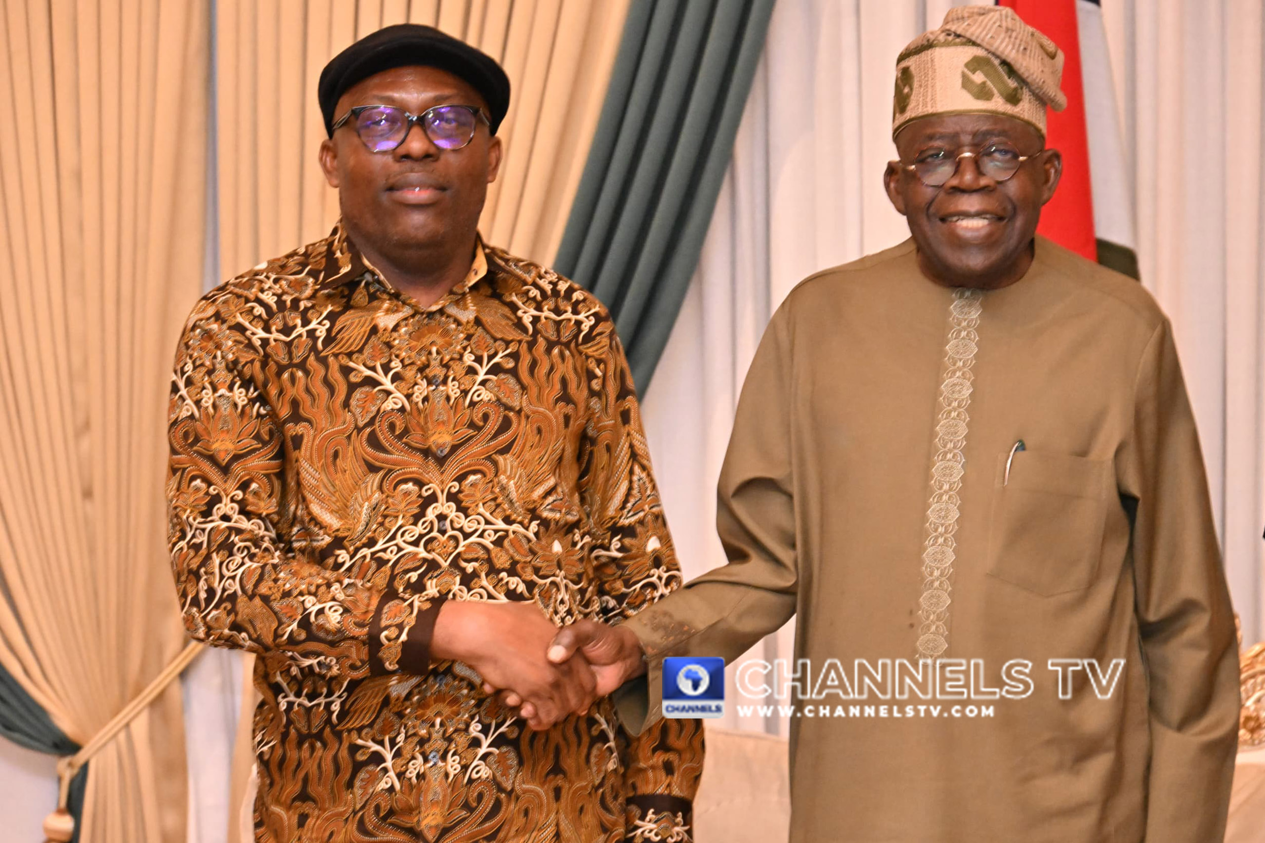 President Tinubu smiles as he shakes hands with Governor Fubara who he suspended on March 18 after declaring a state of emergency in Rivers State