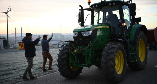 Farmers Enter Paris On Tractors In Protest At Trade Deal