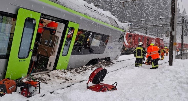 This handout photograph taken and releasaed by Police Cantonale Valaisanne on February 16, 2026 shows a regional train derailed in Goppenstein, southern Switzerland. (Photo by Handout / POLICE CANTONALE VALAISANNE / AFP) /