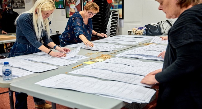 Election workers recount ballots in the Marselisborg Hallen in Aarhus, Denmark on March 25, 2026. (Photo by Mikkel Berg Pedersen / Ritzau Scanpix / AFP) /