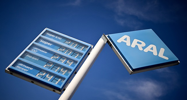 A photo taken on March 13, 2026 shows a display with the prices for Super E10, Super, Diesel and other fuel at an Aral oil and gas station in Berlin, Germany. The German government plans to combat high fuel prices by regulating gas station pricing and releasing oil reserves. (Photo by Tobias SCHWARZ / AFP)